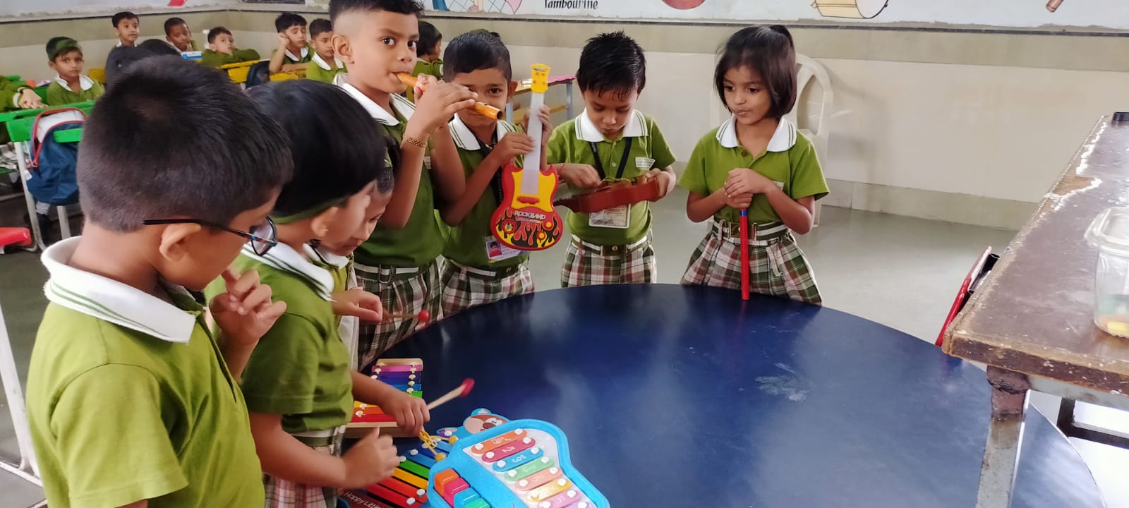 Playing with own Musical instrument toys and understand the sound